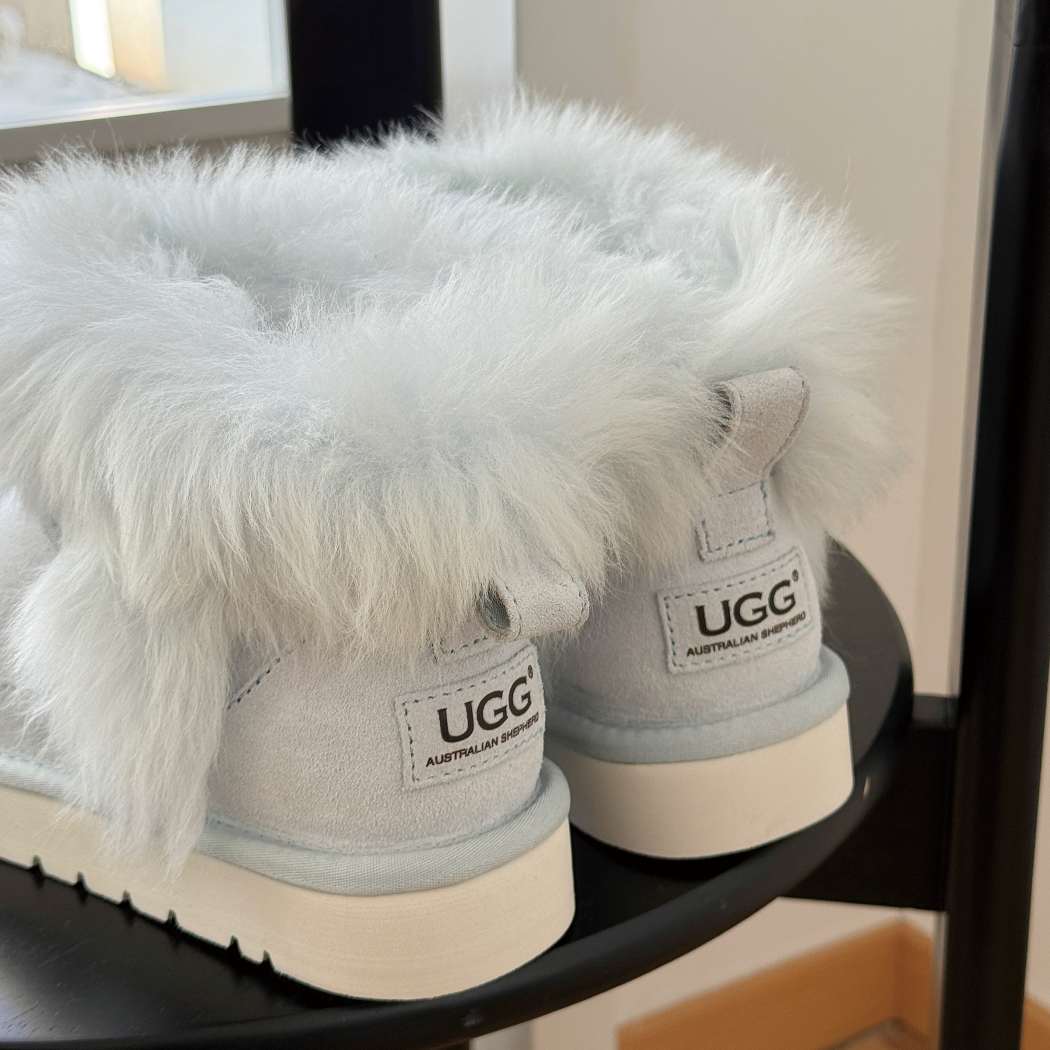 Back view of AUSTRALIAN SHEPHERD® UGG Boots Women Sheepskin Wool Trim Ankle Frovia AS 3131 in Aqua Blue featuring premium cow suede, soft sheepskin wool trim, and a durable EVA sole.