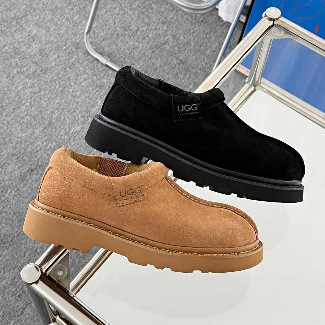 Black and brown UGG shoes on a metal stand with a gray background