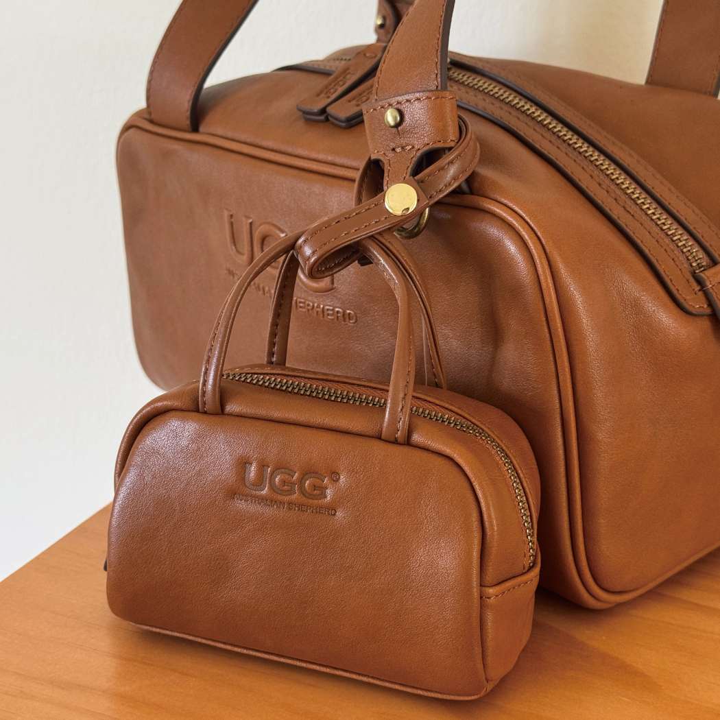 Rear view of AUSTRALIAN SHEPHERD® Dunelight Leather Barrel Crossbody Bag ASA 065 showing the structured genuine leather design.