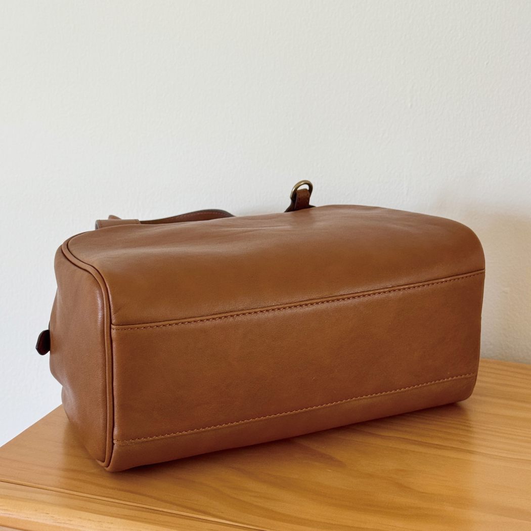 Bottom view of AUSTRALIAN SHEPHERD® Dunelight Leather Barrel Crossbody Bag ASA 065 showing the structured leather base and durable construction.