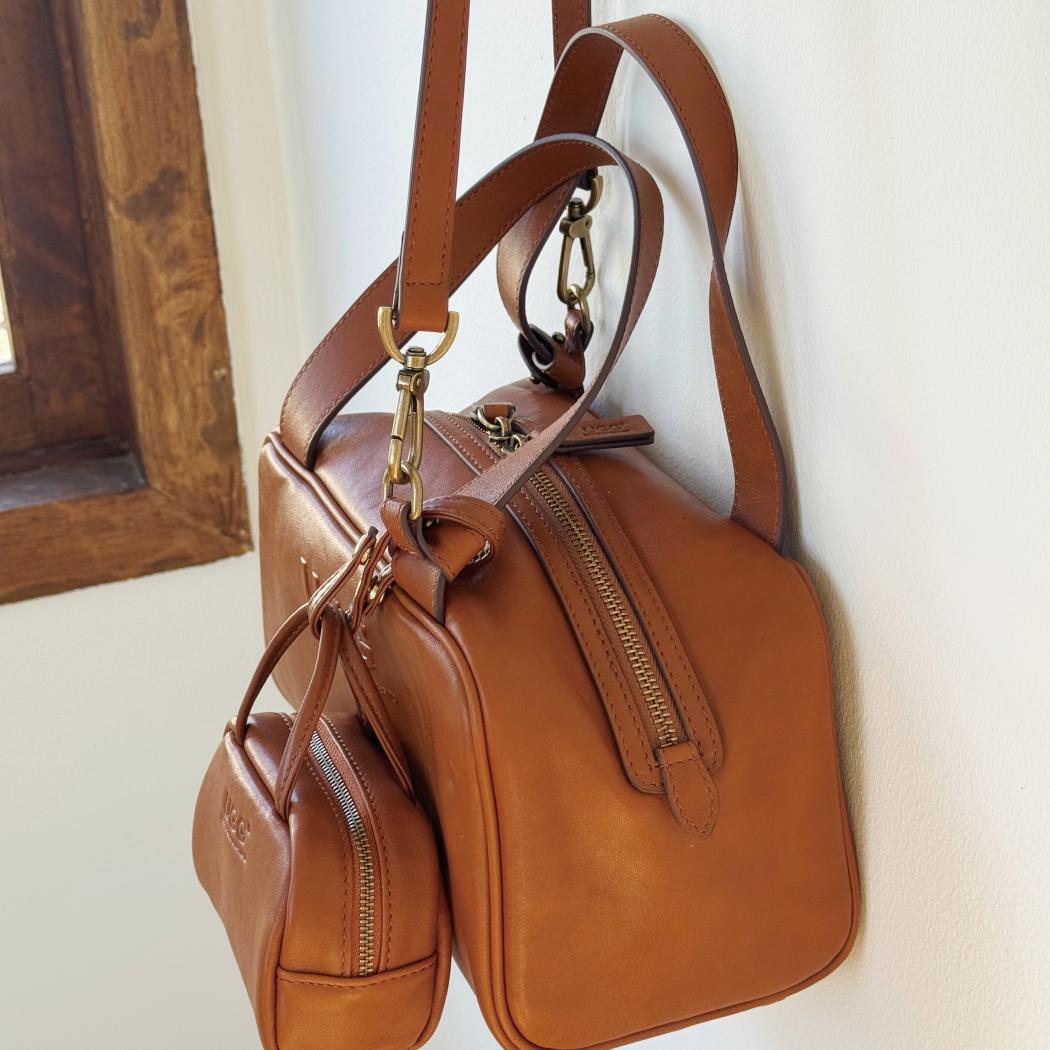 Side view of AUSTRALIAN SHEPHERD® Dunelight Leather Barrel Crossbody Bag ASA 065 in Chestnut showcasing the barrel silhouette and premium leather finish.