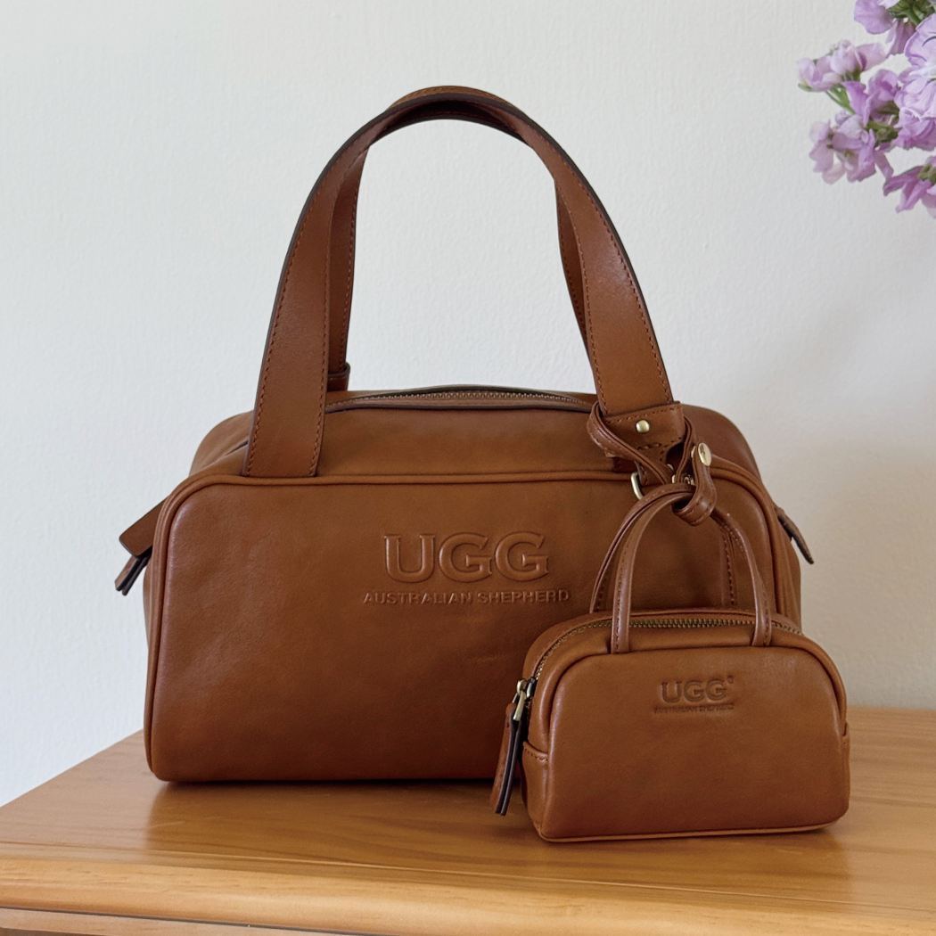 Front display of AUSTRALIAN SHEPHERD® Dunelight Leather Barrel Crossbody Bag ASA 065 in Chestnut with detachable mini pouch.