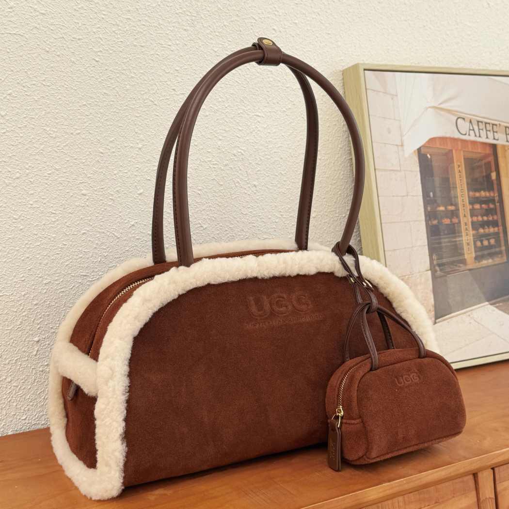 Angled view of AUSTRALIAN SHEPHERD® Snowbelle Wool & Leather Barrel Handbag ASA 064 in Chocolate with matching mini pouch and leather handles.