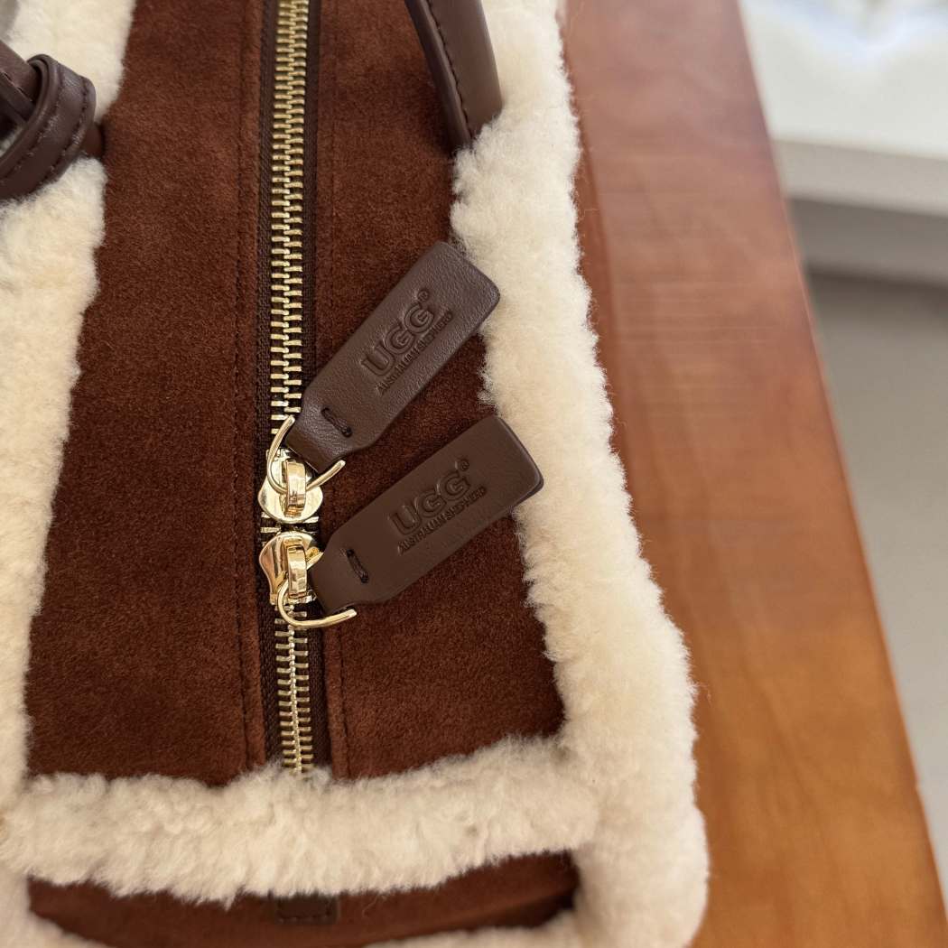 Close-up of AUSTRALIAN SHEPHERD® Snowbelle Wool & Leather Barrel Handbag ASA 064 showing the adjustable leather shoulder strap and premium hardware.
