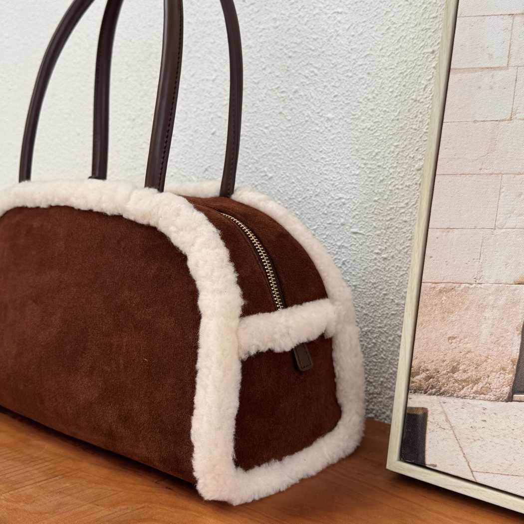 Top view of AUSTRALIAN SHEPHERD® Snowbelle Wool & Leather Barrel Handbag ASA 064 showcasing premium leather handles and soft wool trim.