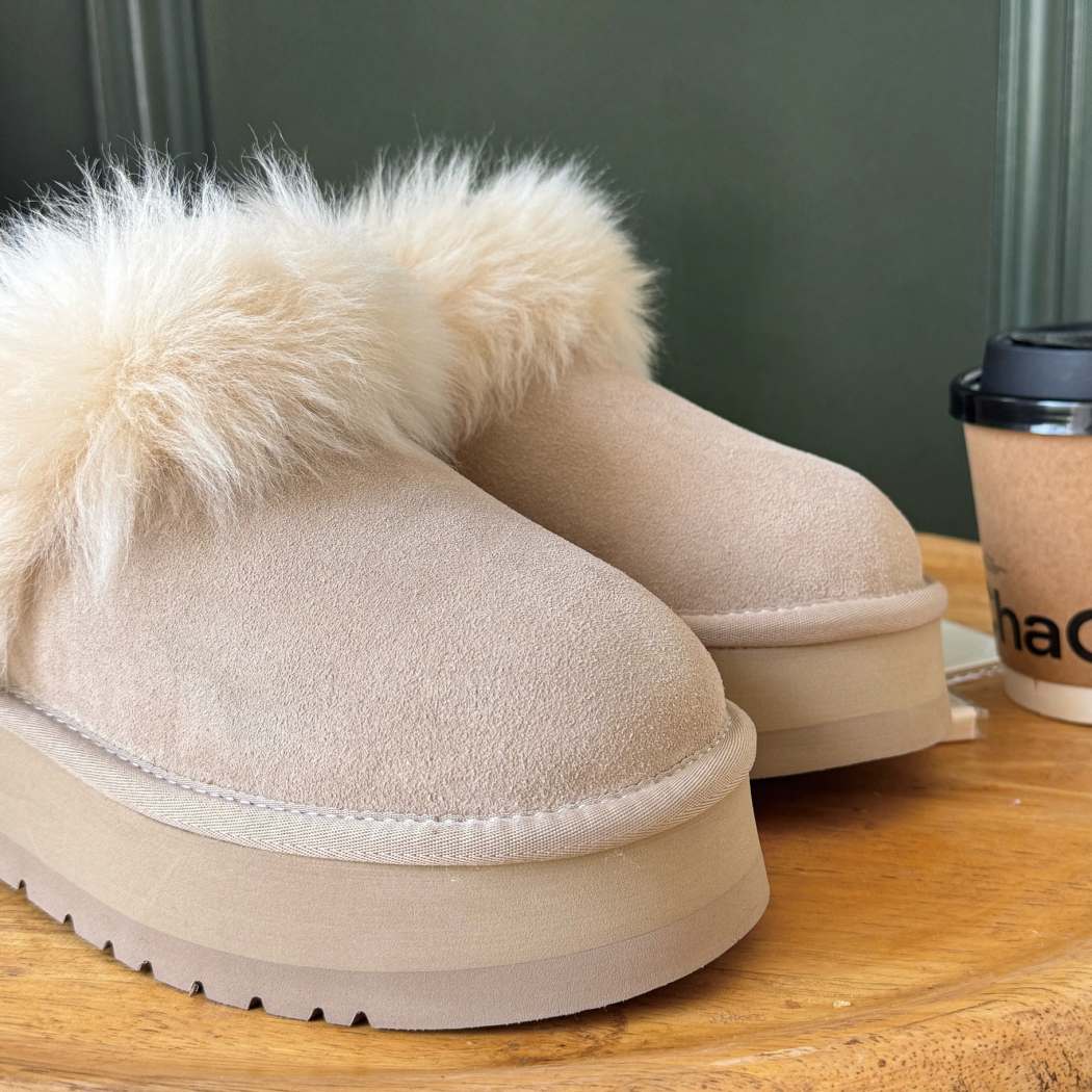 Close-up side view of AUSTRALIAN SHEPHERD® UGG Ankle Platform Slippers Sheepskin Wool Collar Mianee AS 2134 featuring premium cow suede, soft sheepskin wool, and a cushioned platform sole.