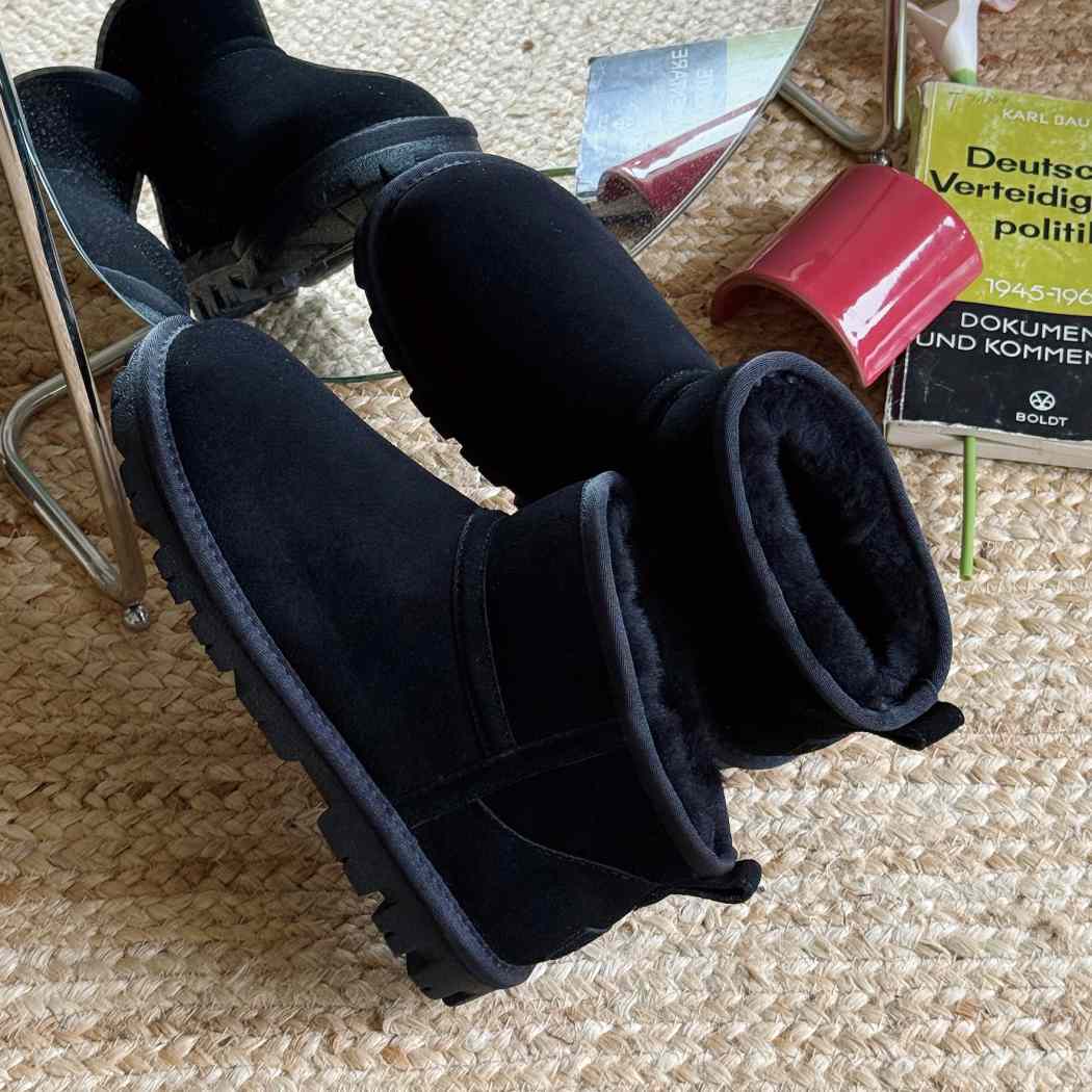 Angled view of AUSTRALIAN SHEPHERD® UGG Boots Sheepskin Wool Ankle Chorin AS 3093 in Black with premium cow suede upper and cosy Australian sheepskin wool.