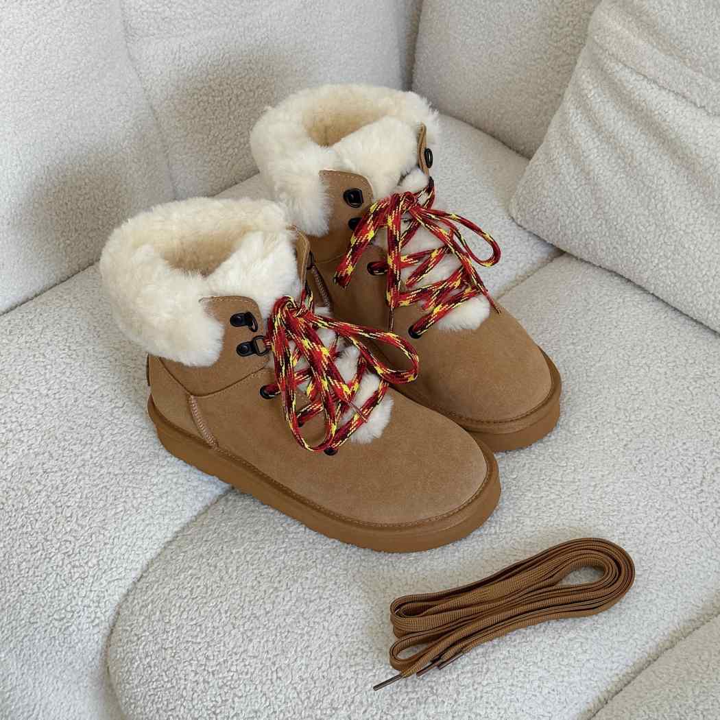 Angled view of AUSTRALIAN SHEPHERD UGG Boots Sheepskin Wool Collar Lace Up Trego AS 3110 highlighting the colourful lace-up closure and plush wool collar.
