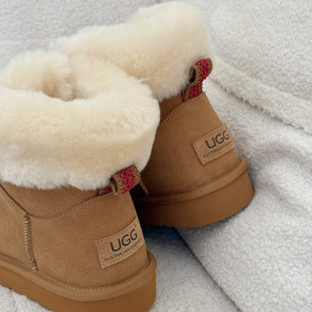 Rear view of AUSTRALIAN SHEPHERD UGG Boots Sheepskin Wool Collar Lace Up Trego AS 3110 featuring premium suede and signature heel branding.
