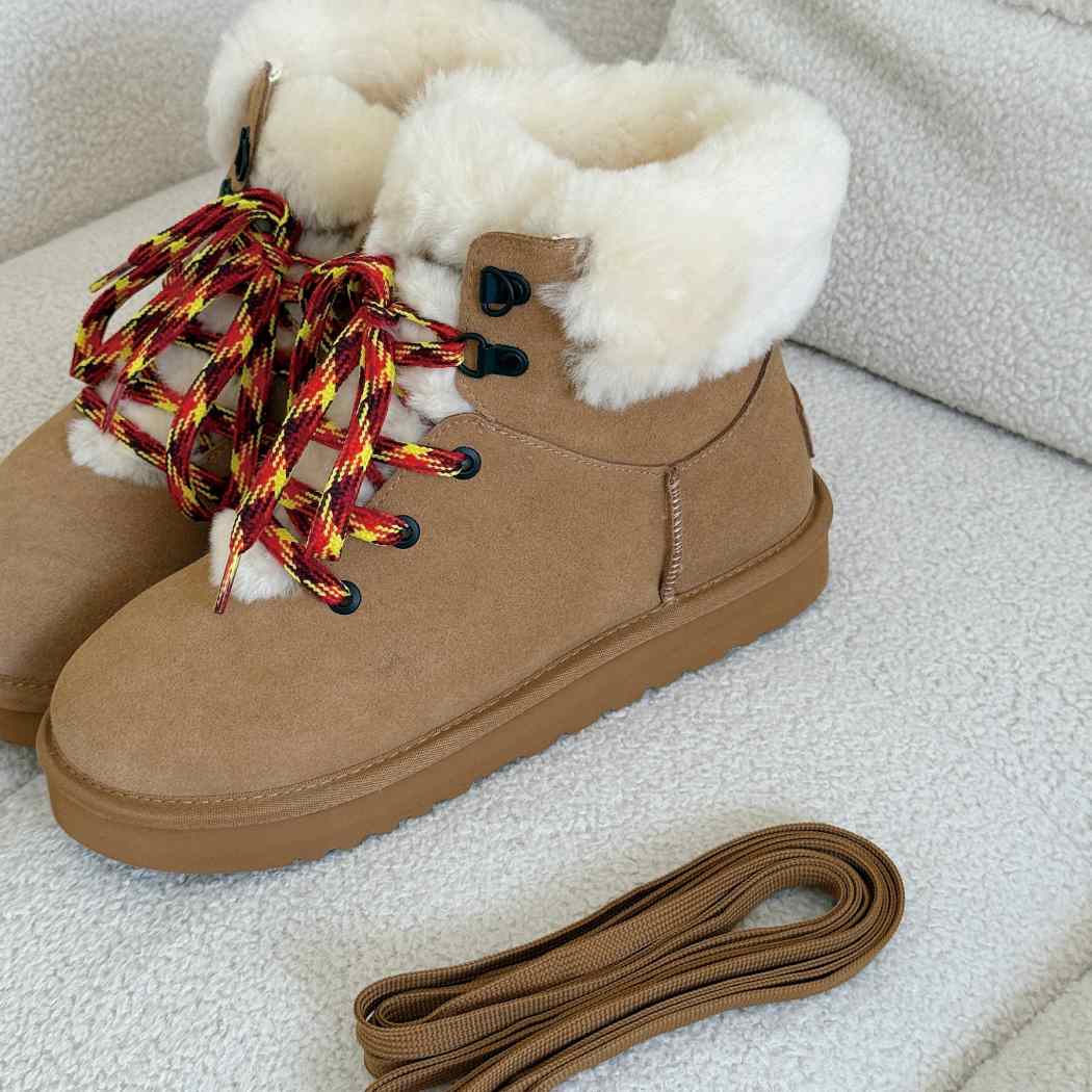 Close-up of AUSTRALIAN SHEPHERD UGG Boots Sheepskin Wool Collar Lace Up Trego AS 3110 showing the removable patterned shoelaces and soft sheepskin wool collar.