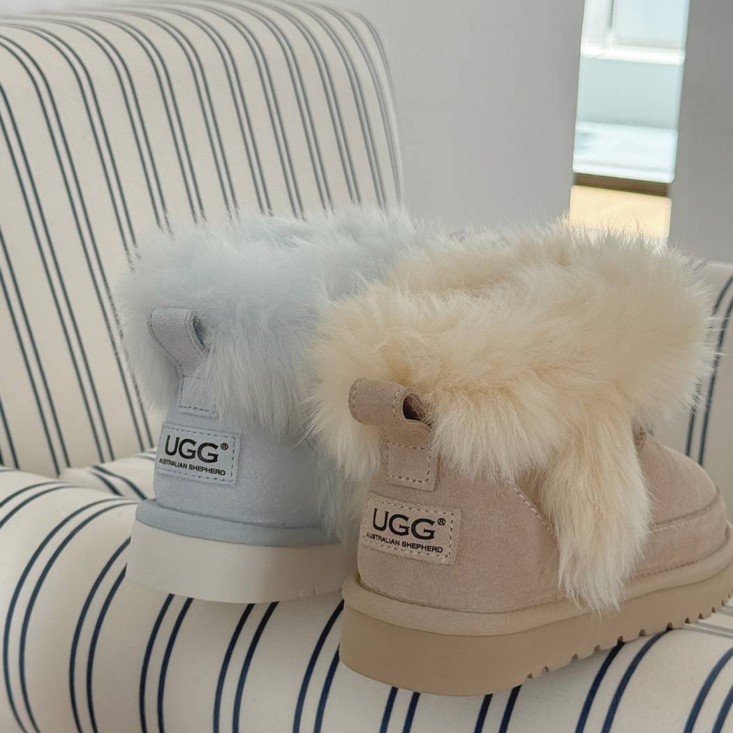 Angled front view of AUSTRALIAN SHEPHERD® UGG Boots Women Sheepskin Wool Trim Ankle Frovia AS 3131 in Aqua Blue highlighting the plush sheepskin wool trim and premium suede upper.