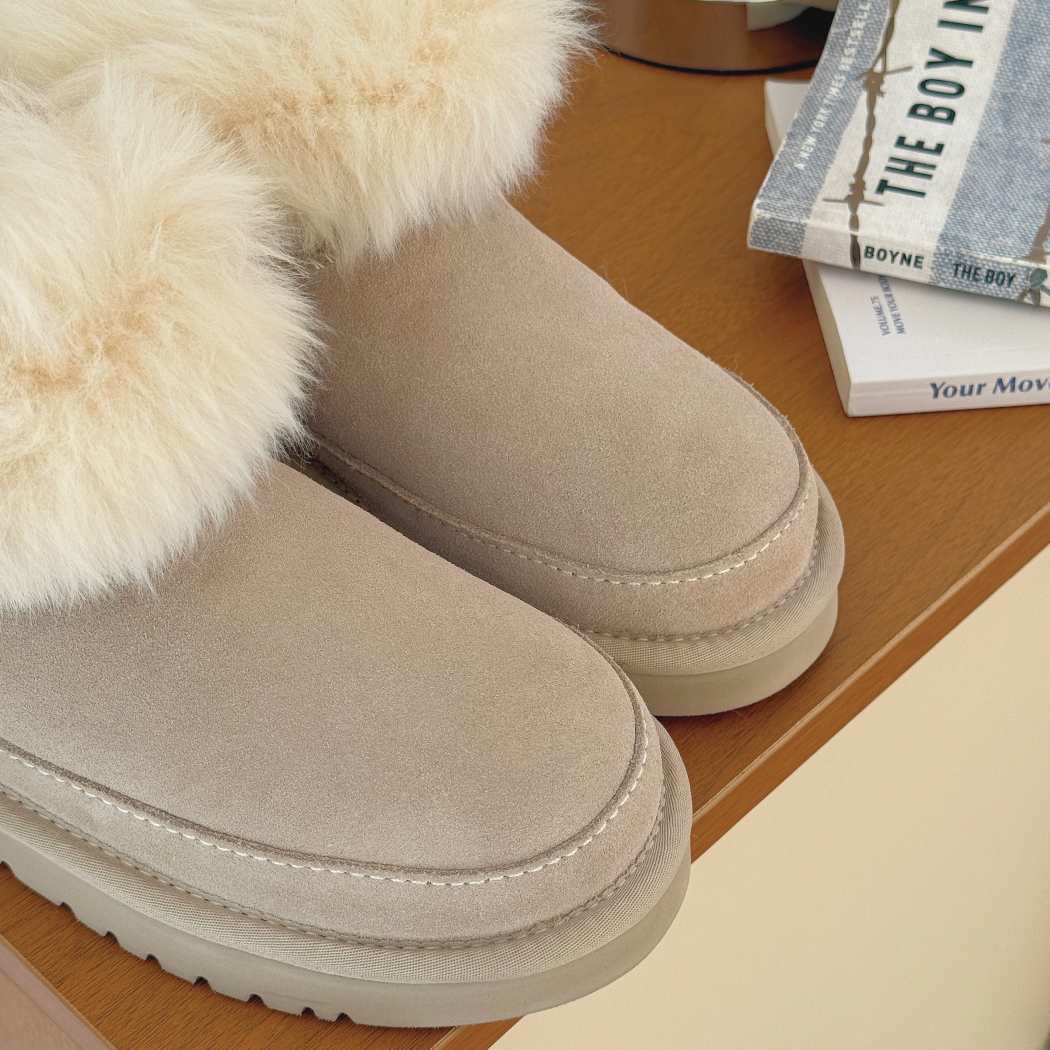 Close-up side view of AUSTRALIAN SHEPHERD® UGG Boots Women Sheepskin Wool Trim Ankle Frovia AS 3131 in Sand highlighting the premium suede upper and soft sheepskin wool trim.