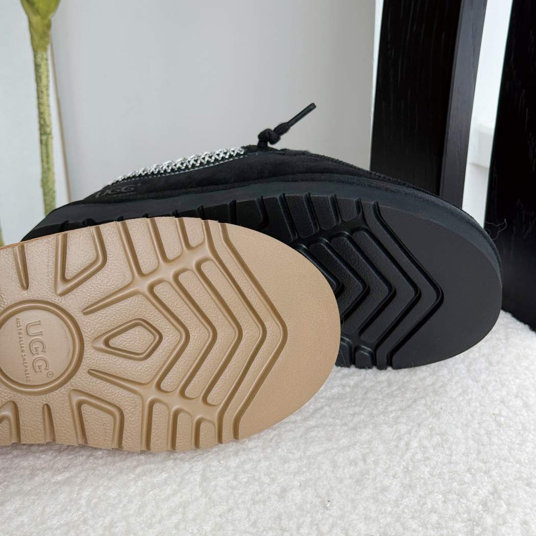 Outsole view of AUSTRALIAN SHEPHERD UGG Marek Sheepskin Wool Lace-Up Slippers AS 7055 in Black showing the durable non-slip sole.