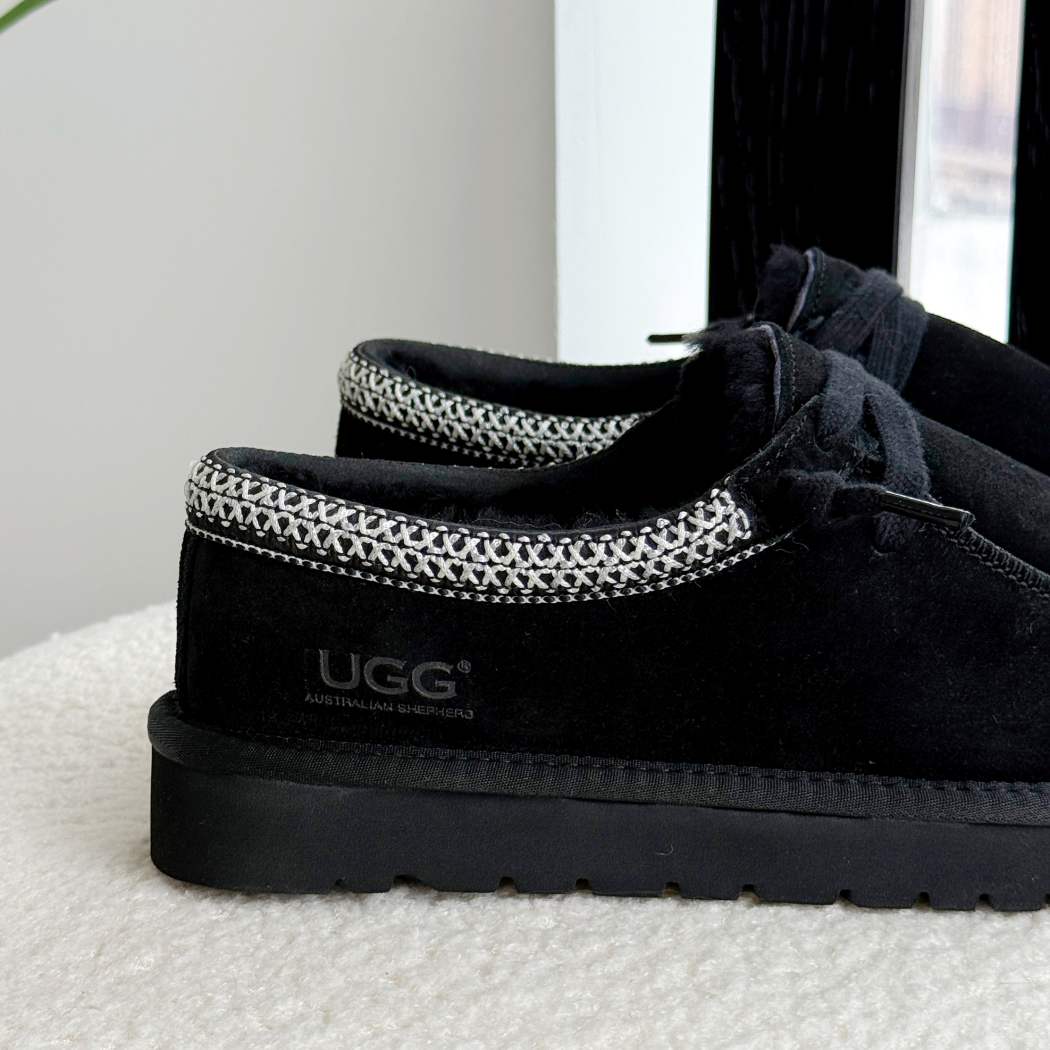 Side profile of AUSTRALIAN SHEPHERD UGG Marek Sheepskin Wool Lace-Up Slippers AS 7055 in Black with lightweight durable outsole.