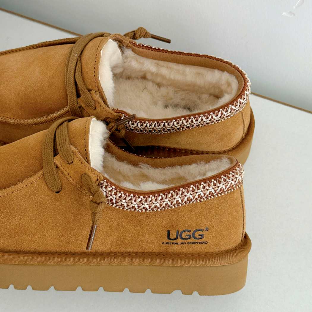 Close-up of AUSTRALIAN SHEPHERD UGG Marek Sheepskin Wool Lace-Up Slippers AS 7055 in Chestnut highlighting genuine suede craftsmanship and wool lining.