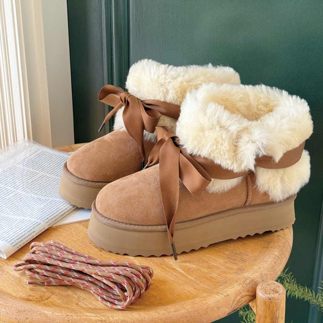Side view of AUSTRALIAN SHEPHERD® UGG Platform Boots Carmont AS 3124 in Chestnut styled with the plush wool collar folded down.