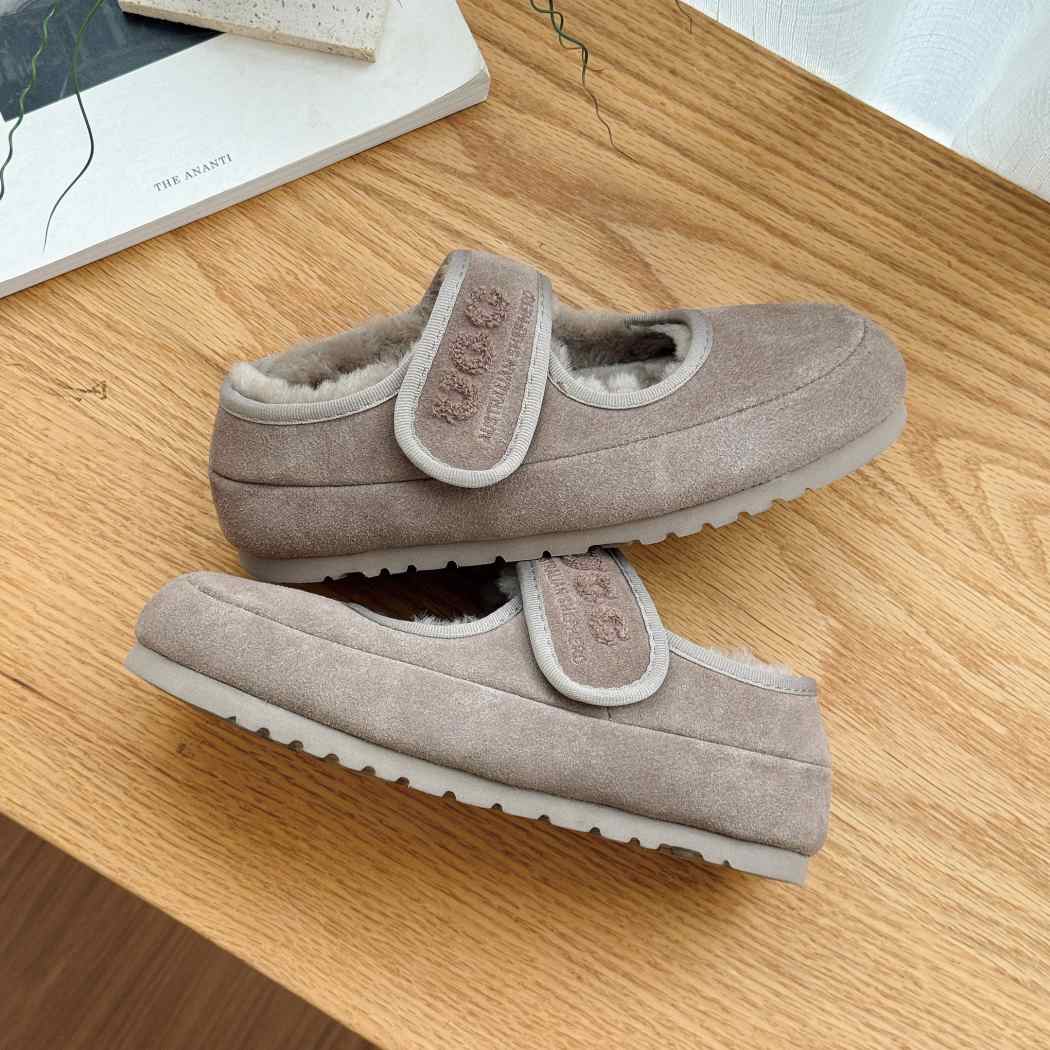 Side view of AUSTRALIAN SHEPHERD UGG Sheepskin Wool Mary Jane Slippers Velvi AS 7024 in Grey with an adjustable Mary Jane strap.