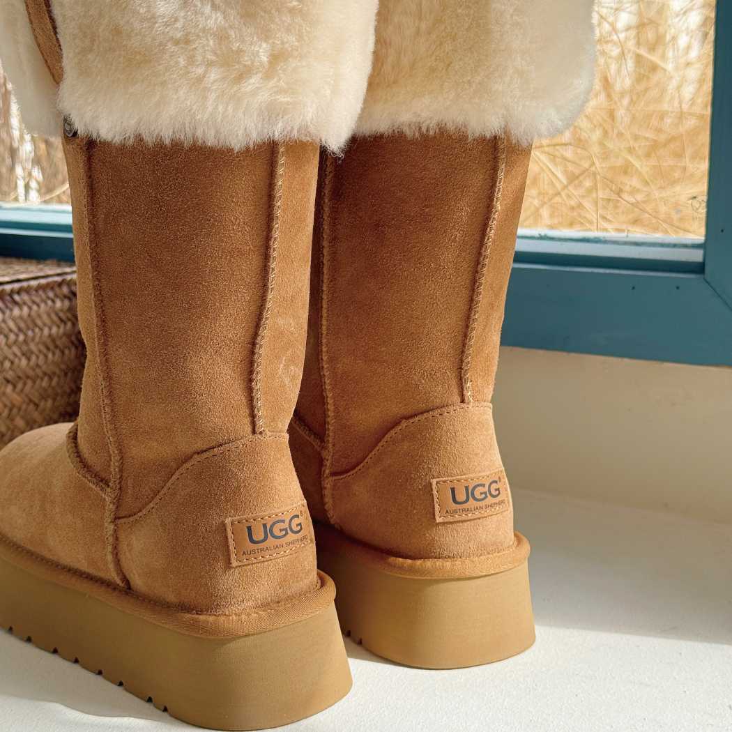 Rear view of AUSTRALIAN SHEPHERD UGG Sheepskin Wool Tall Platform Boots Eleny AS 3153 highlighting the tall shaft and platform outsole.