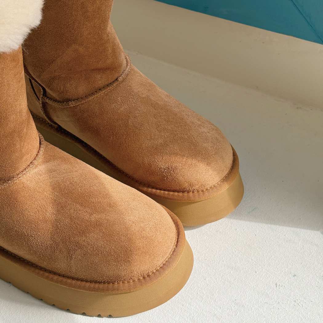 Close-up of AUSTRALIAN SHEPHERD UGG Sheepskin Wool Tall Platform Boots Eleny AS 3153 showing the rounded toe, elevated platform sole, and premium suede upper.