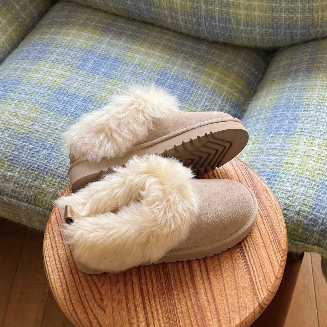 Angled view of AUSTRALIAN SHEPHERD® UGG Slippers Sheepskin Wool Collar Ankle Mianee AS 2135 in Sand showcasing the cosy wool collar and slip-on ankle design.