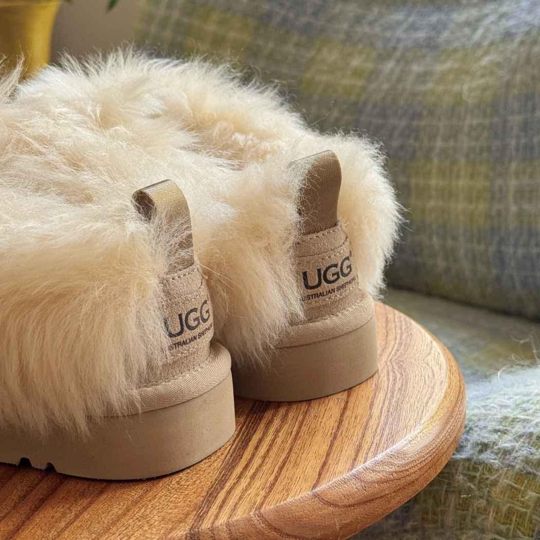 Rear view of AUSTRALIAN SHEPHERD® UGG Slippers Sheepskin Wool Collar Ankle Mianee AS 2135 in Sand showcasing the thick sheepskin wool collar and ankle coverage.