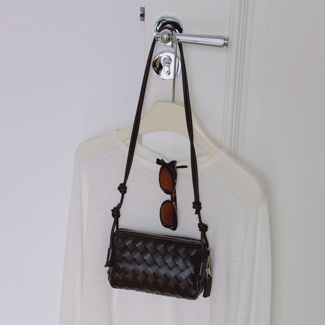 Lifestyle view of AUSTRALIAN SHEPHERD® Wefton Leather Crossbody Bag ASA 075 displaying the adjustable crossbody strap and compact silhouette.