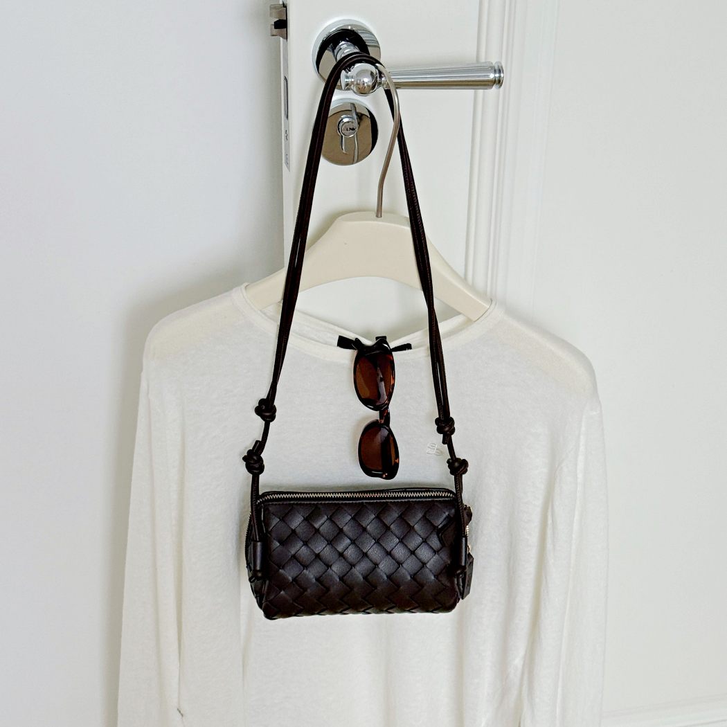 Hanging display of AUSTRALIAN SHEPHERD® Wefton Leather Crossbody Bag ASA 075 in Chocolate with woven leather detailing.