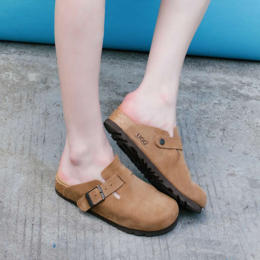 Side lifestyle view of Classic Birken cow suede clogs OZ 7001 in Chestnut