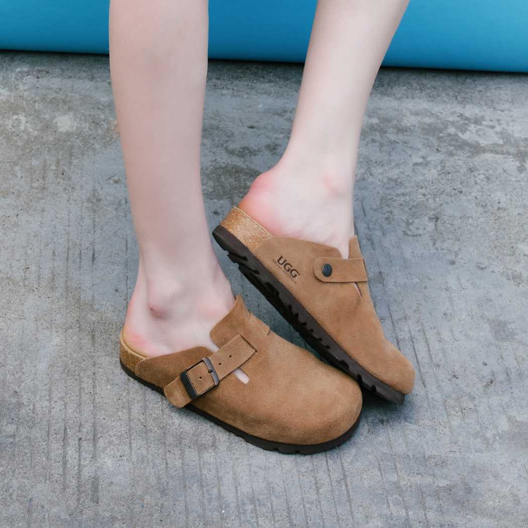 Lifestyle walking view of Classic Birken cow suede clogs OZ 7001 in Chestnut