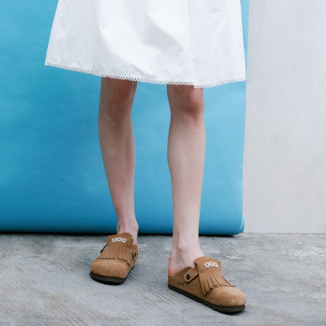 Lifestyle photo featuring Classic Birken cow suede clogs OZ 7001 with a dog