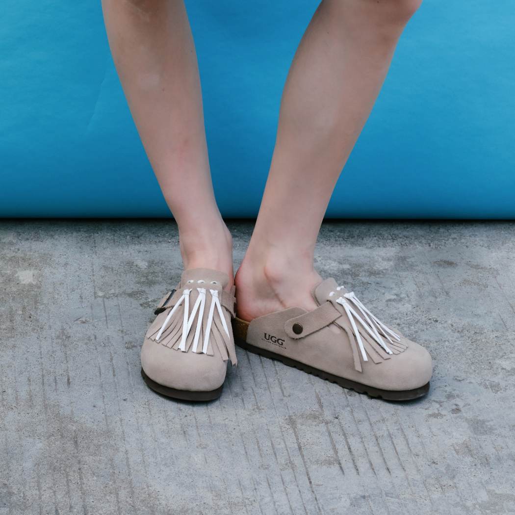 Front lifestyle view of Classic Birken cow suede clogs OZ 7001 in Taupe