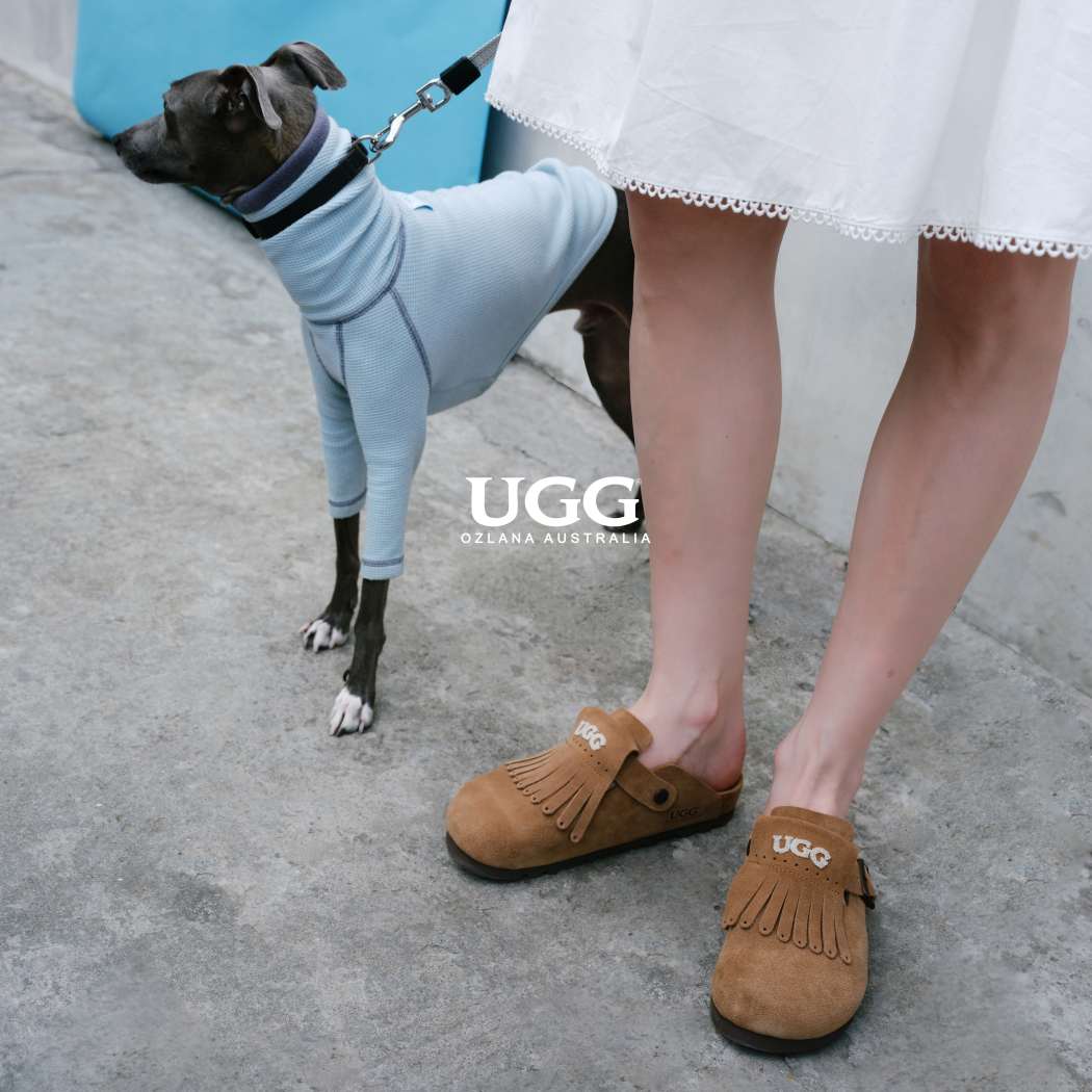 Lifestyle photo featuring Classic Birken cow suede clogs OZ 7001 in Taupe with a dog