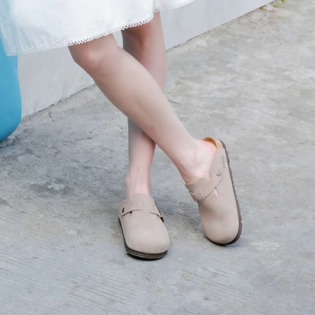 Close-up walking view of Classic Birken cow suede clogs OZ 7001 in Taupe