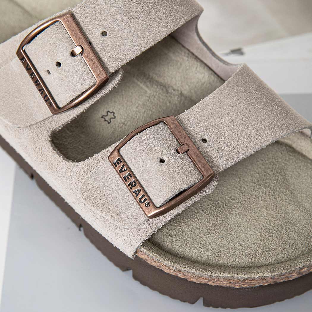 Close-up of EVERAU® Adjustable Strap Embossed Slip-on Platform Summer Sandal Slides EA 7056 featuring embossed buckles, premium cow suede, and a cushioned cork footbed.