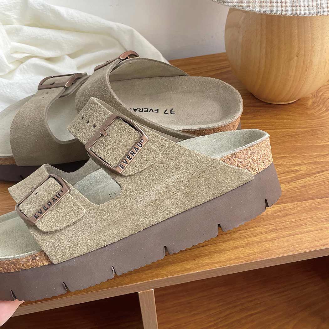 Angled view of EVERAU® Adjustable Strap Embossed Slip-on Platform Summer Sandal Slides EA 7056 in Grey with a lightweight platform sole.