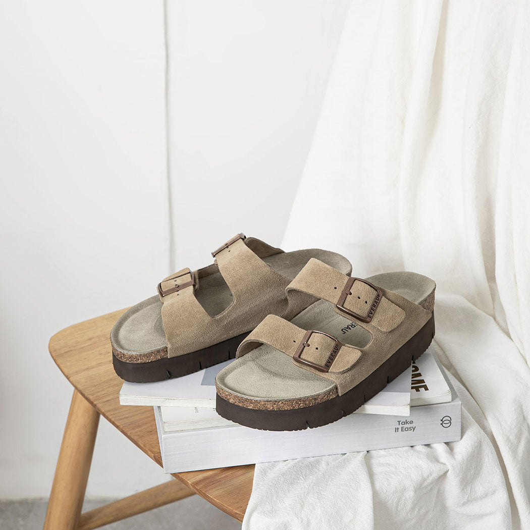 Lifestyle view of EVERAU® Adjustable Strap Embossed Slip-on Platform Summer Sandal Slides EA 7056 in Grey with premium cow suede upper.