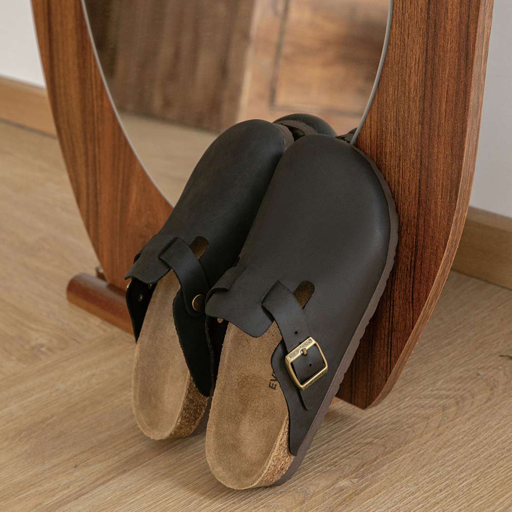 Angled view of EVERAU Brooklyn Adjustable Buckled Slides Women Leather Slip-On Flat Sandals EA 7058 in Black with premium leather and a cork footbed.