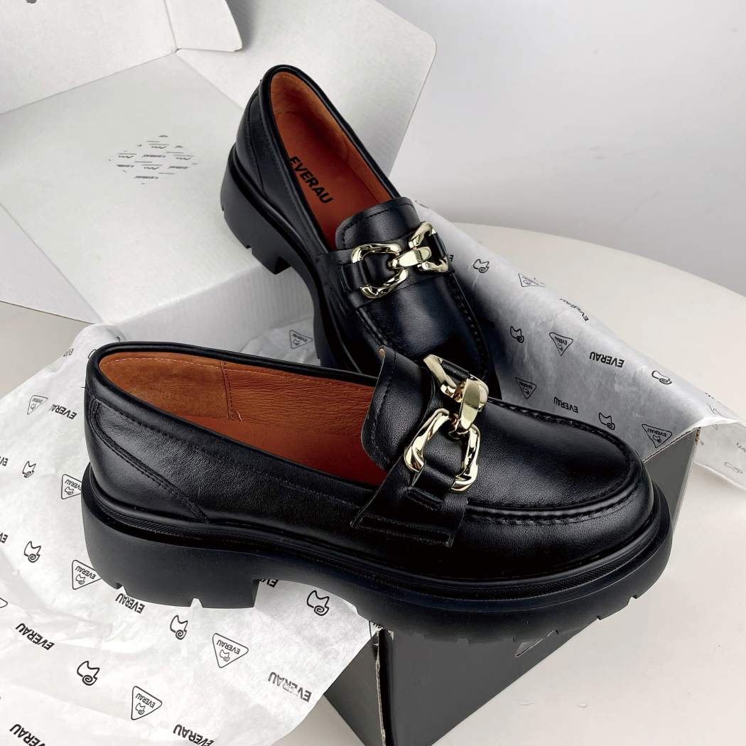 Angled view of EVERAU® Women Leather Gold Buckle Platform Chunky Loafers Della EA 7032 in Black with a durable chunky outsole.