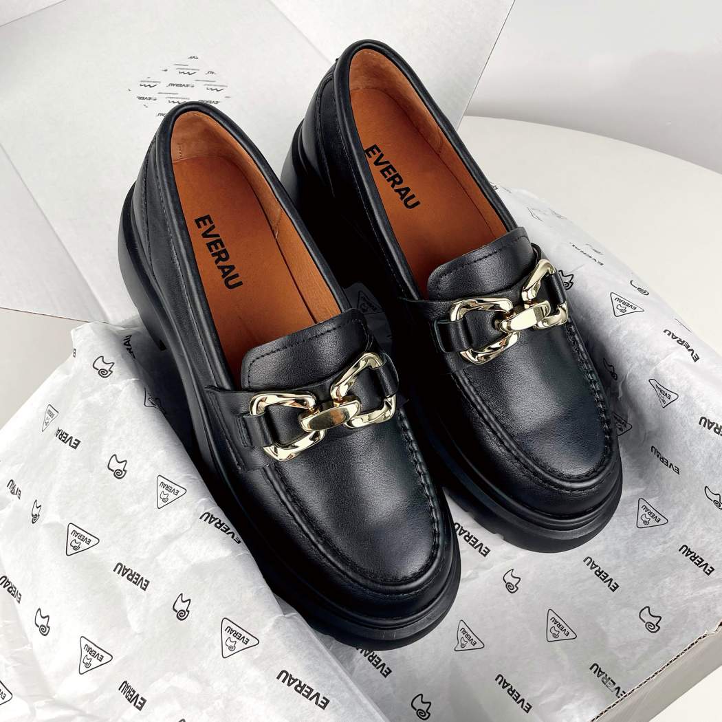 Pair of EVERAU® Women Leather Gold Buckle Platform Chunky Loafers Della EA 7032 in Black with a classic chunky loafer design.
