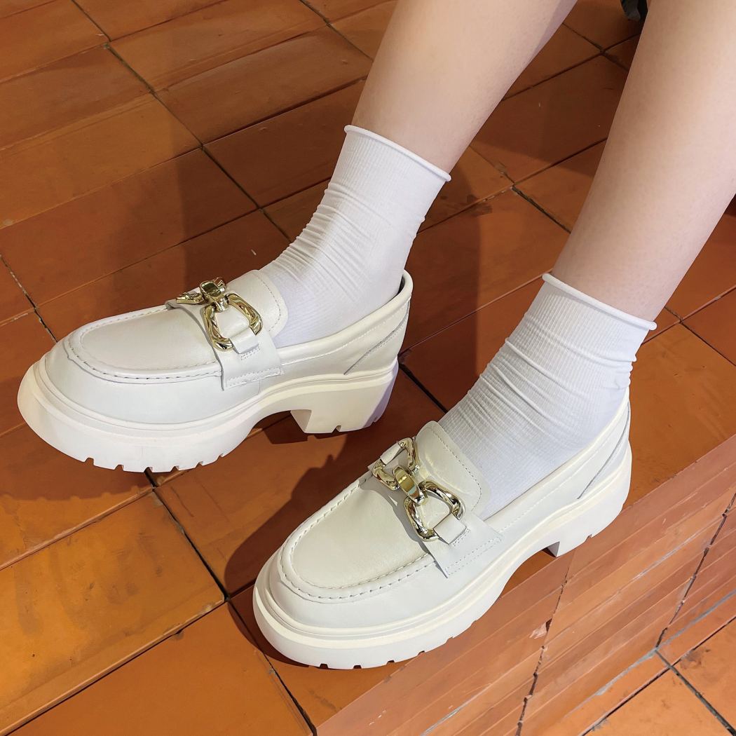 Lifestyle view of EVERAU® Women Leather Gold Buckle Platform Chunky Loafers Della EA 7032 in Cream with a chunky platform sole and elegant gold buckle.