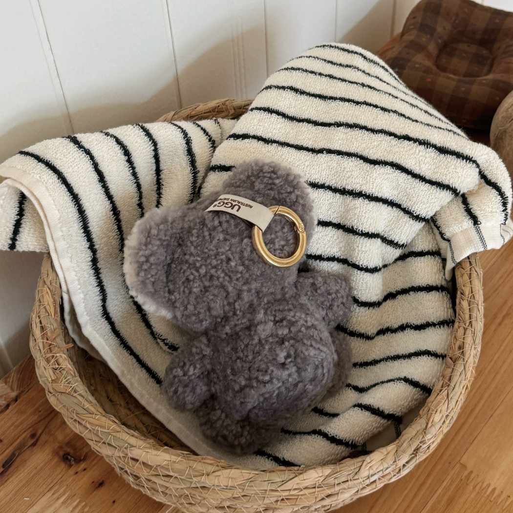 Koobi sheepskin wool koala keyring bag charm ASZ 041 displayed on a cushion