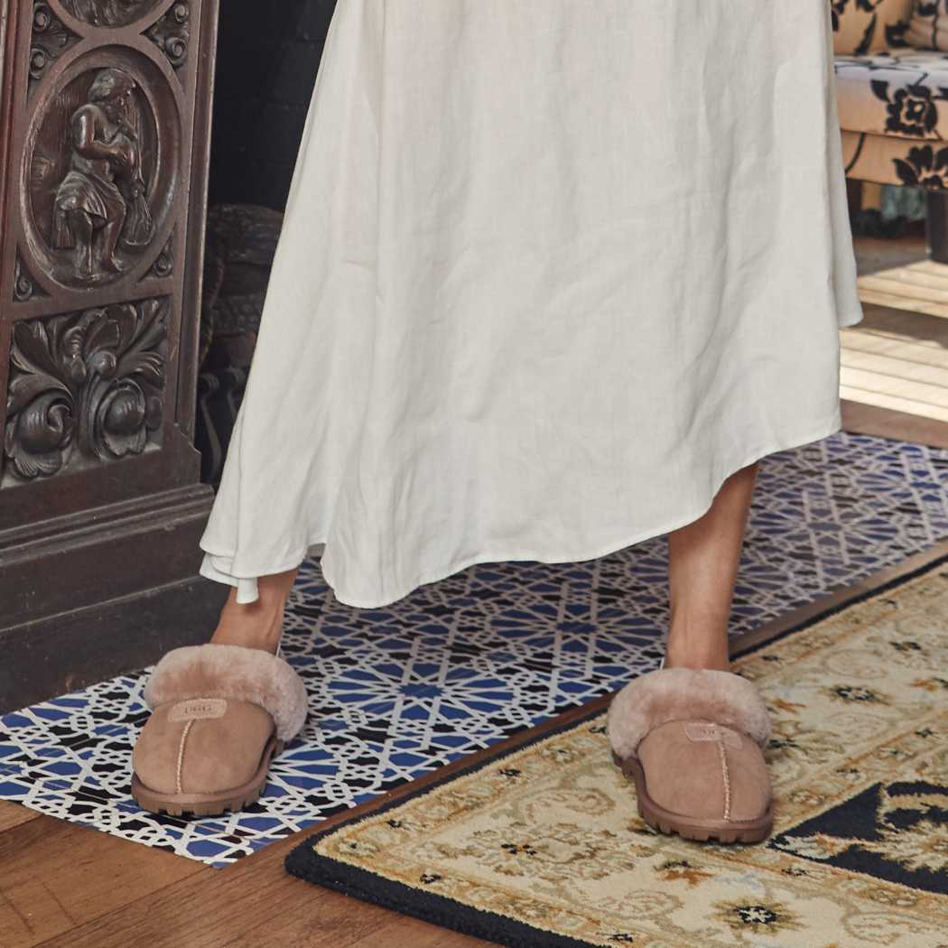 Outdoor lifestyle view of OZWEAR UGG® Premium Australian Sheepskin Slippers OB114II showcasing versatile everyday wear.